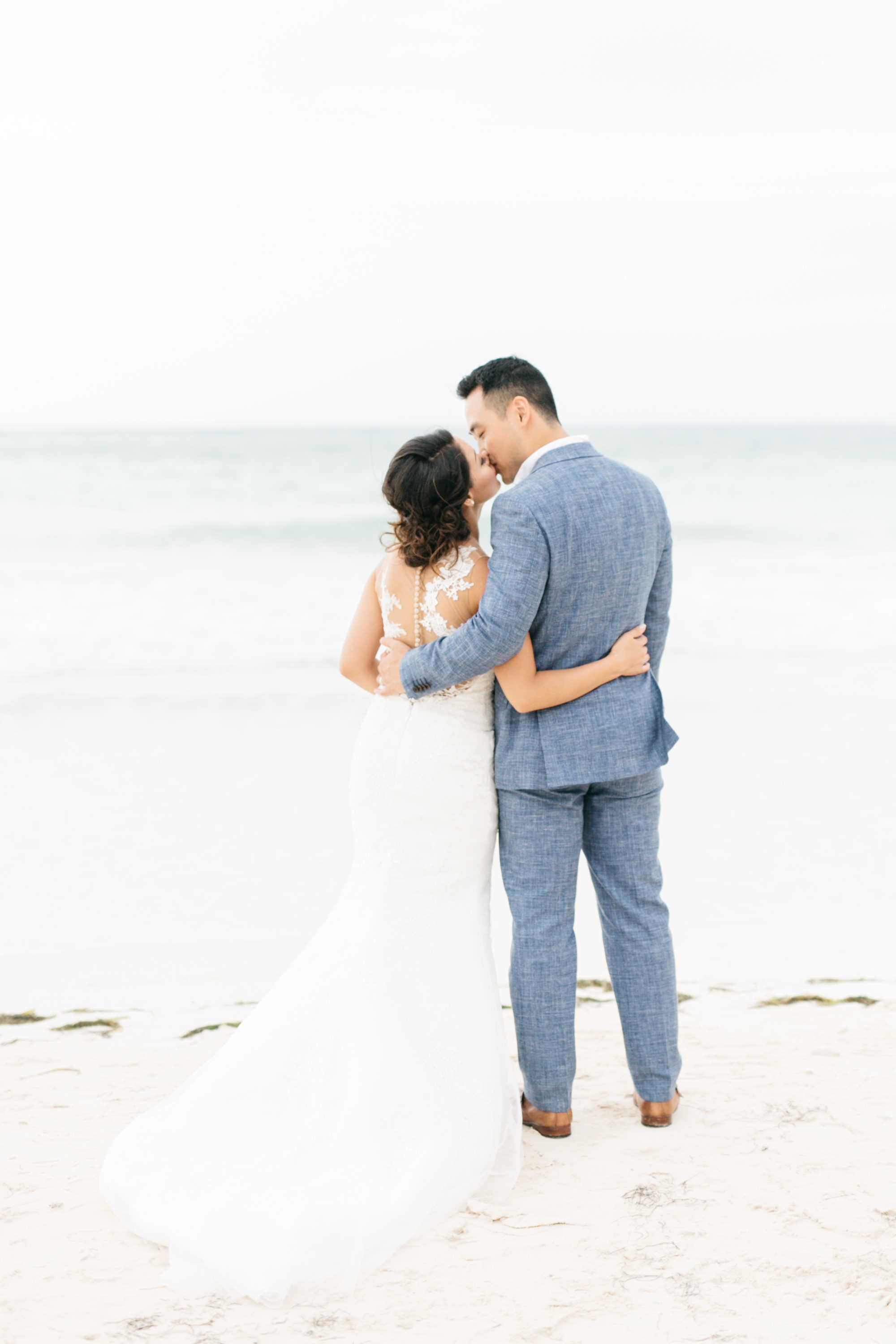 Bride and groom on beach in Jamaica