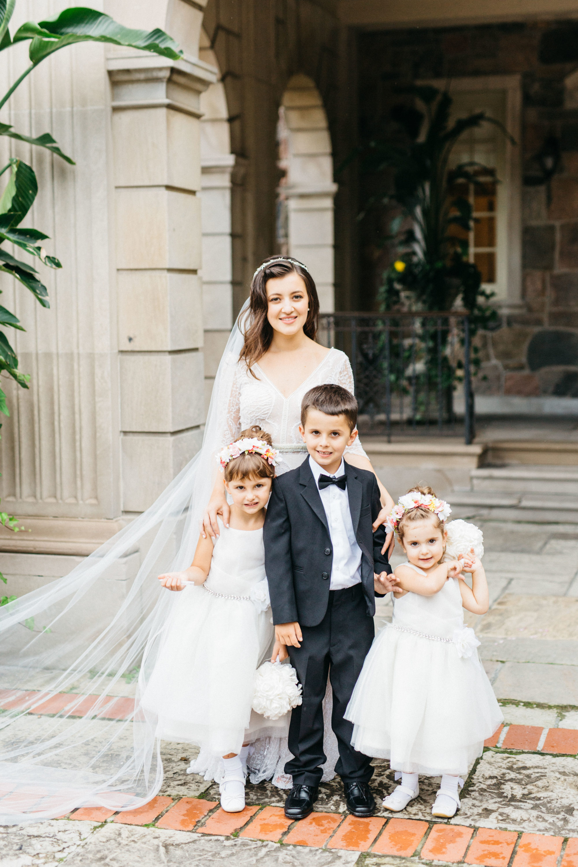 Bride with flower girls and ring boy at Bride and groom at Graydon Hall Manor