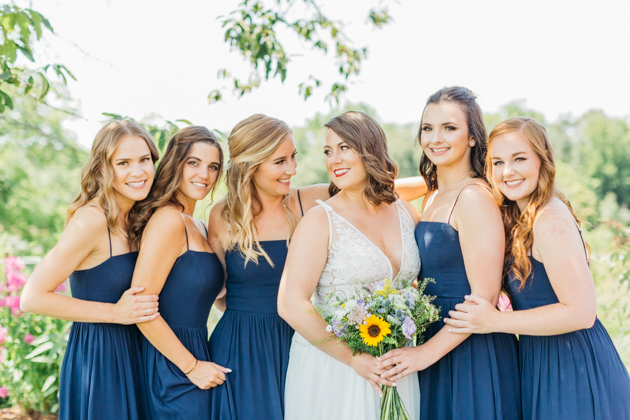 Bride with bridesmaids at Stonewall Estates