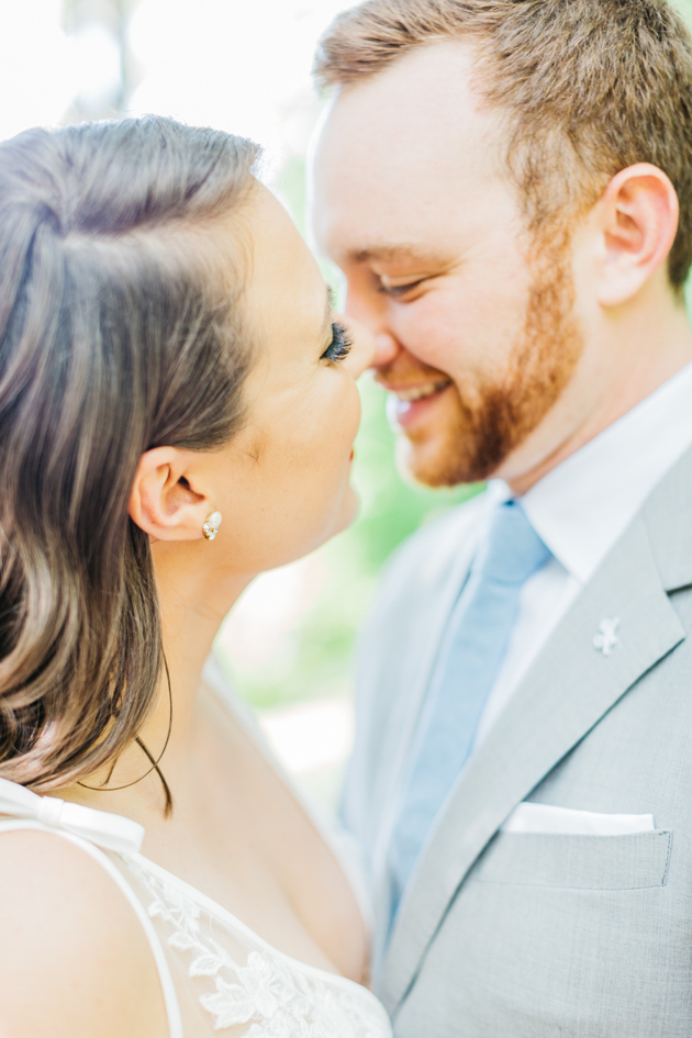 Bride and groom slowly kiss at Stonewall Estates