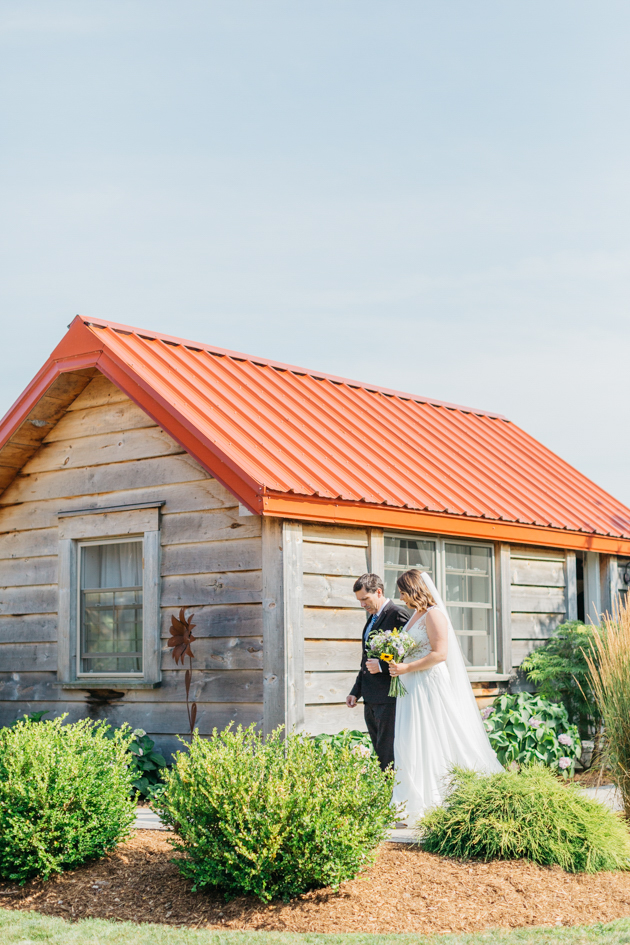 Bride walking down aisle with dad at Stonewall Estates