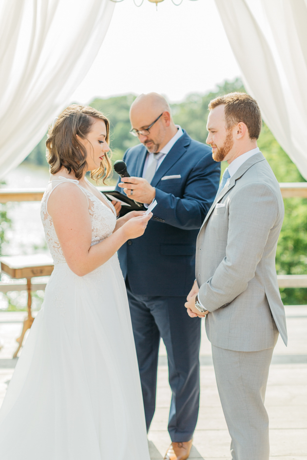 Bride reading vows at Stonewall Estates